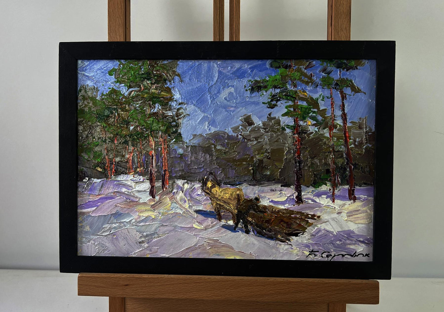 Framed oil painting of snowy forest road with foxes by Boris Serdyuk