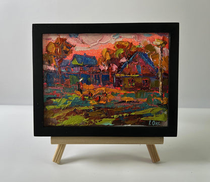 Oil painting Pink village evening by Oksana Ivanyuk in black frame