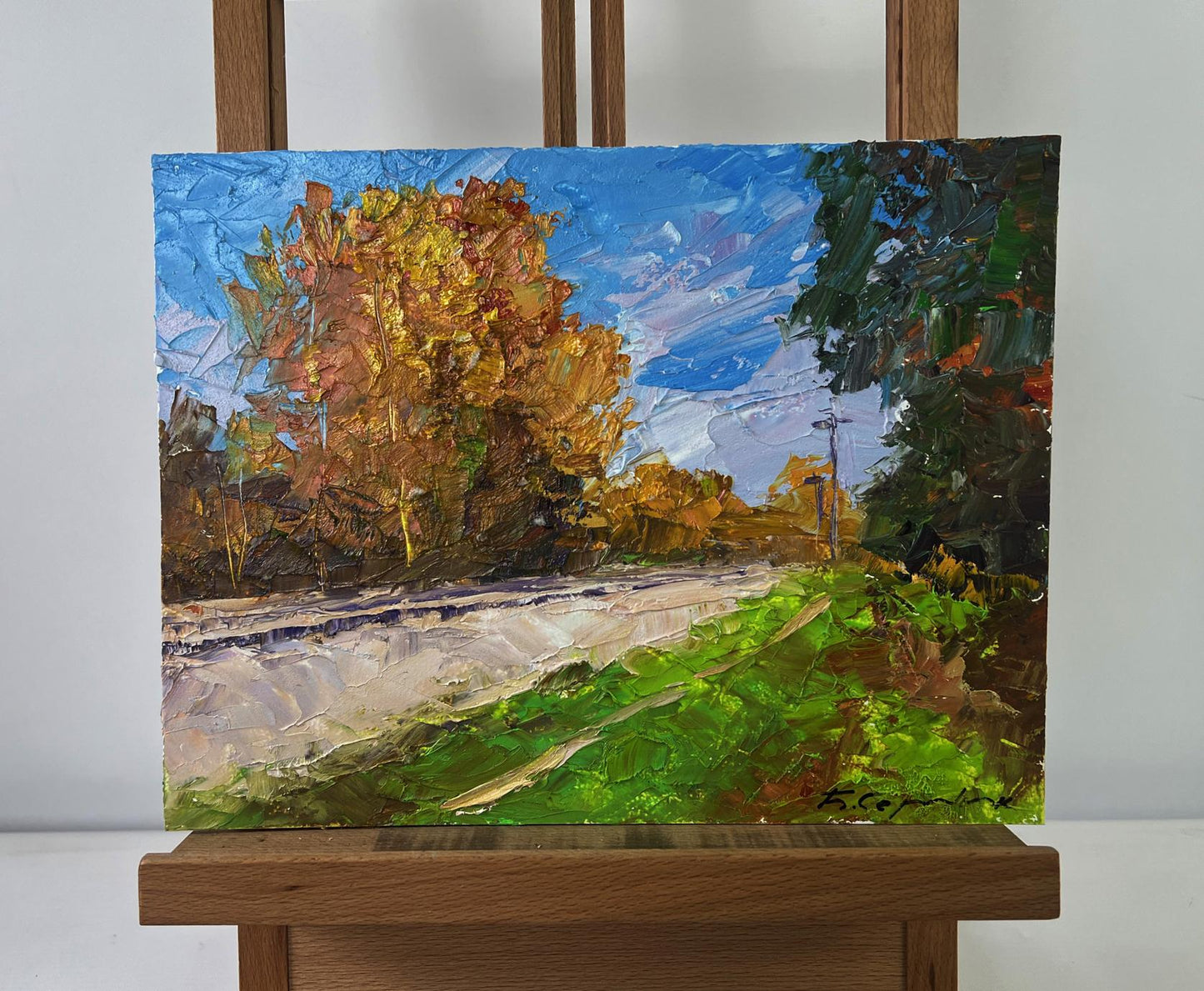 Oil painting Autumn silence on the road by Boris Serdyuk on wooden easel