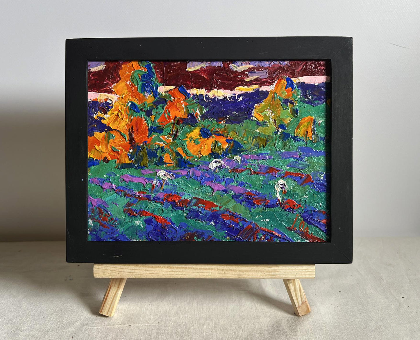 Oil painting Crimson Evening in the Field by Oleksiy Ivanyuk in black frame