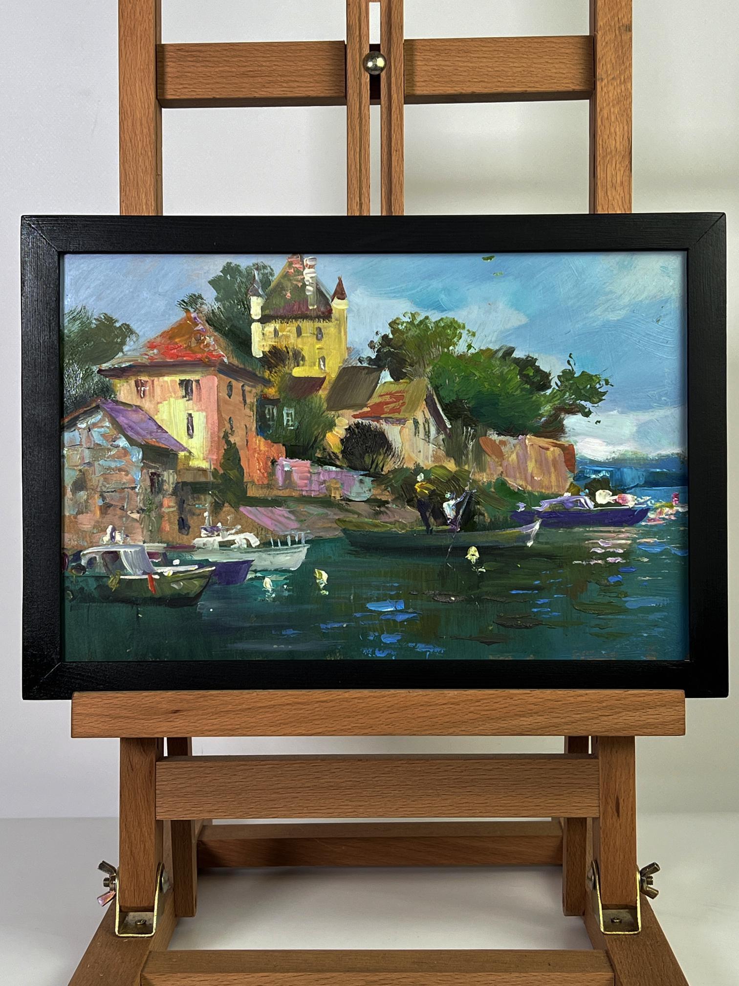 Framed oil painting of colorful coastal village with boats by Yuriy Suprunchuk