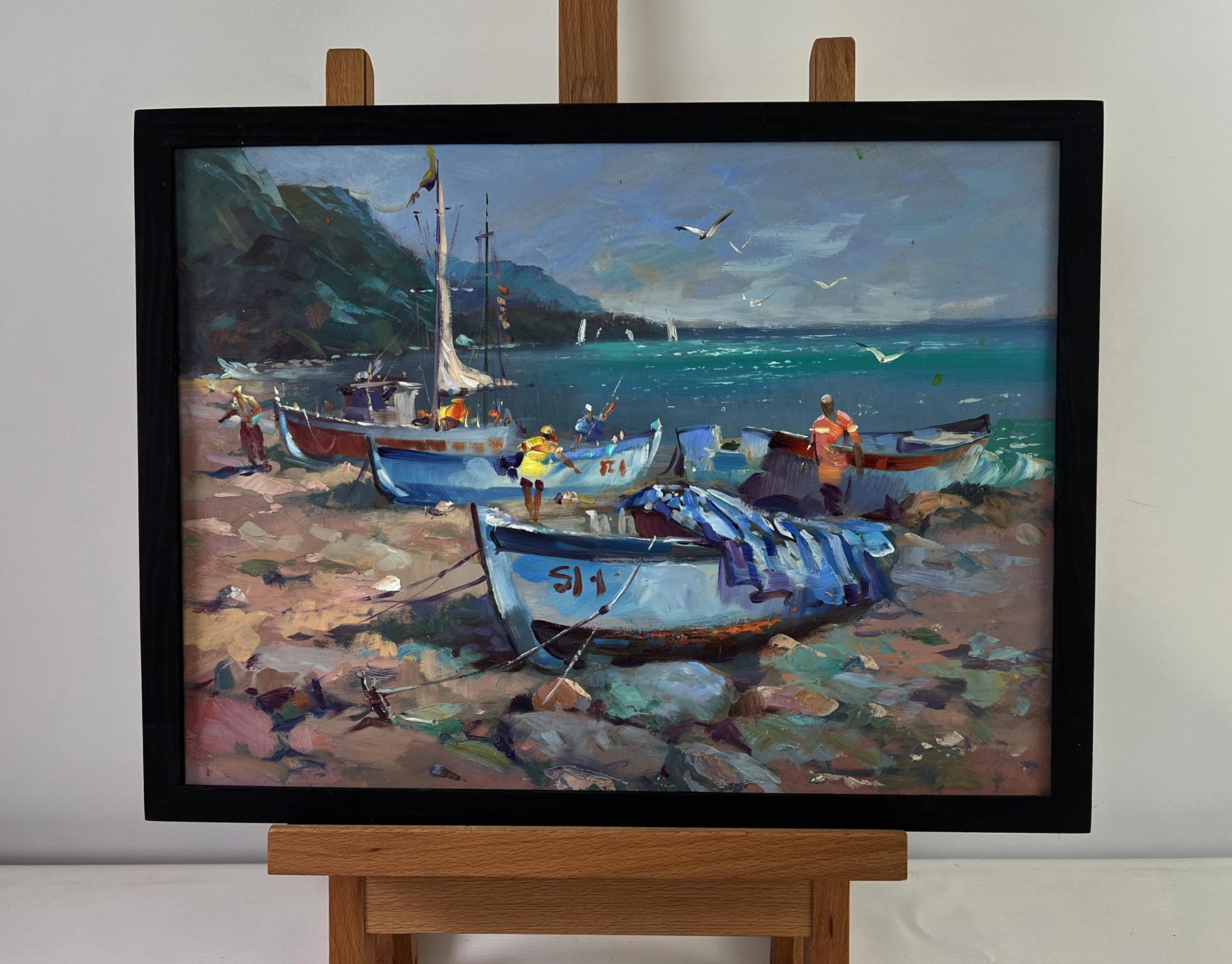 Framed oil painting of fishermen on rocky coastal shore by Yuri Suprunchuk