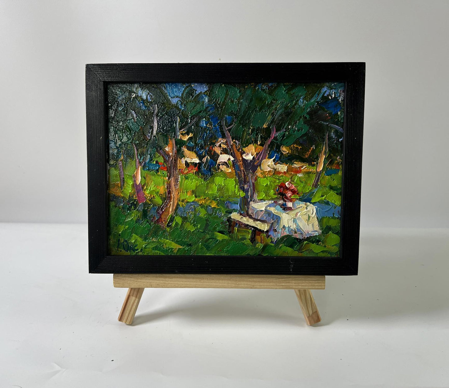 Oil painting Morning coolness by Oksana Ivanyuk: vibrant green garden tea scene
