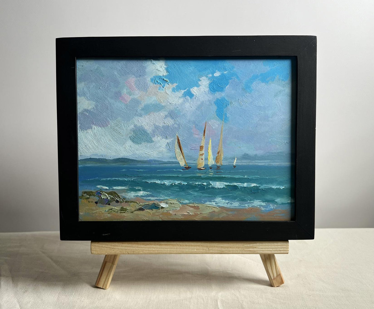 Framed oil painting of sailboats at sea by Yuriy Suprunchuk