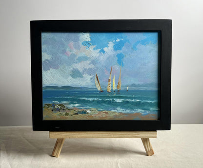 Framed oil painting of sailboats at sea by Yuriy Suprunchuk