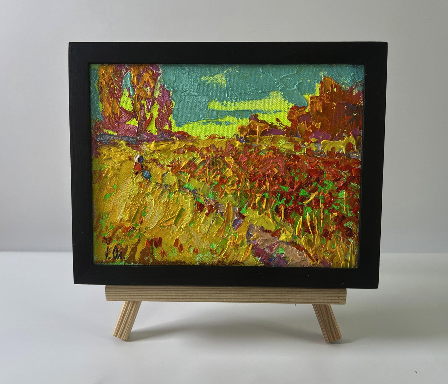 Oil painting of autumn flower fields by Oleksiy Ivanyuk in black frame