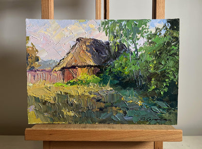Oil painting of Boris Serdyuk house in field with thatched cottage in lush trees