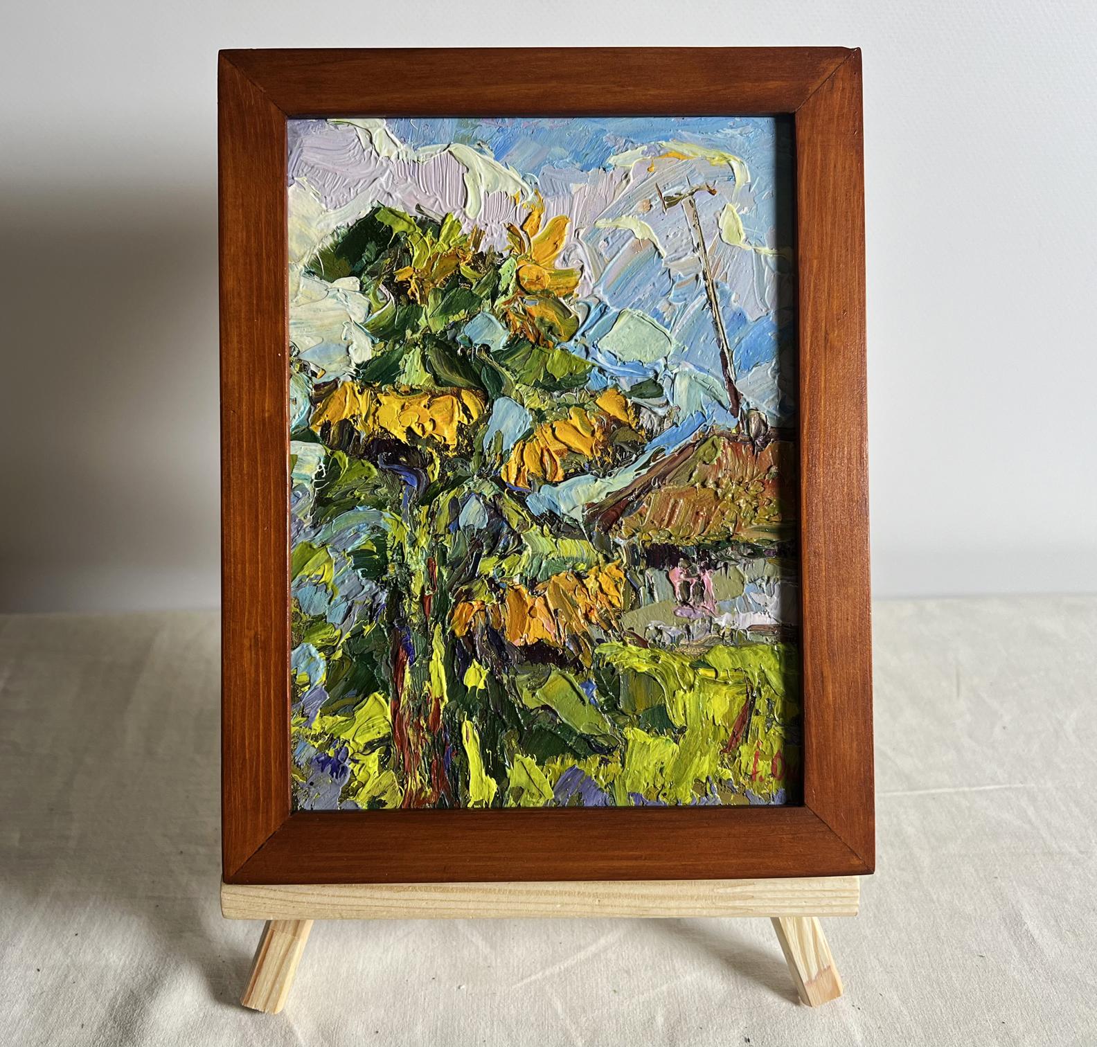 Vibrant oil painting of sunflowers near the house by Oksana Ivanyuk in rustic frame
