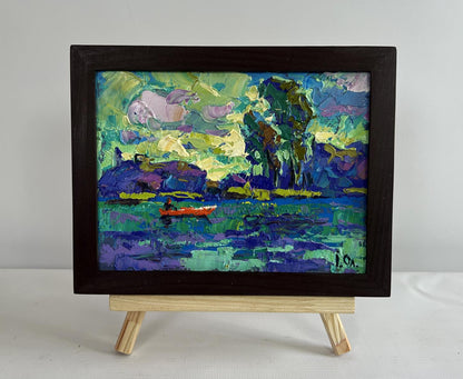 Oil painting of river and yellow sunset by Oleksiy Ivanyuk in wooden frame