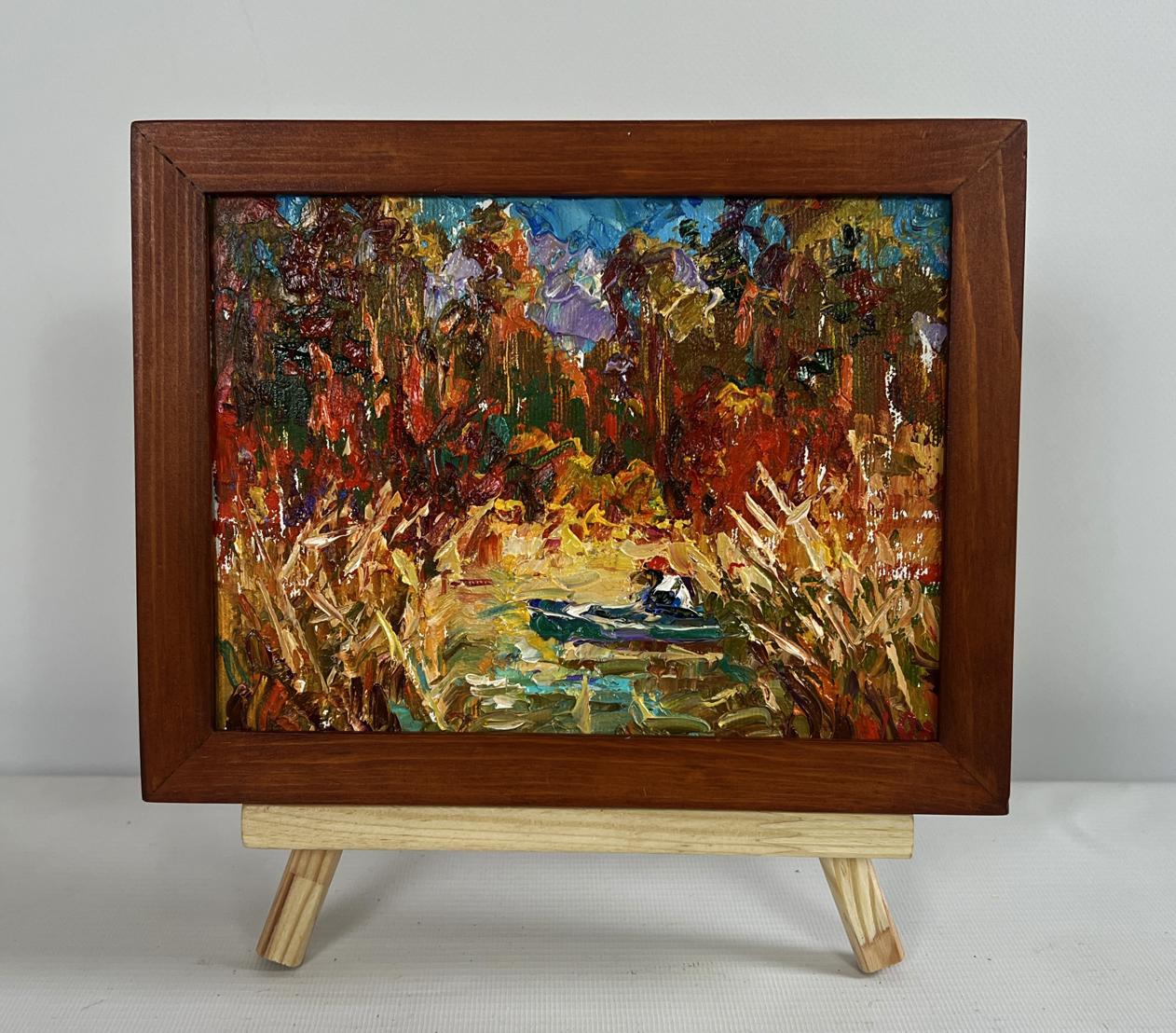 Oleksiy Ivanyuk oil painting of lake with autumn trees, boat, reeds in brown frame