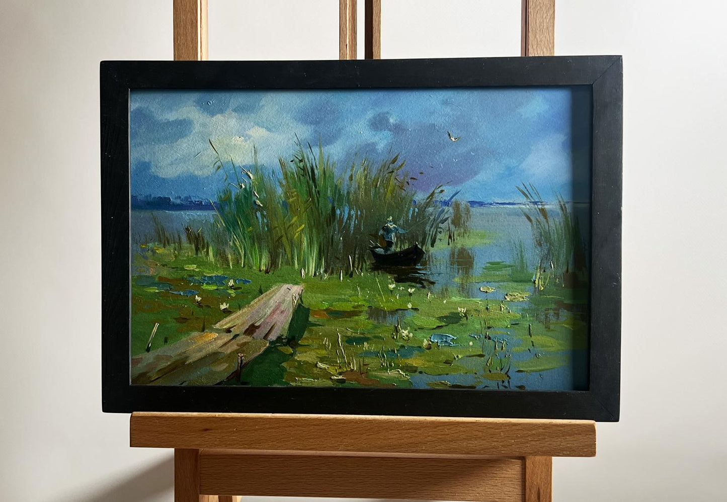 Oil painting of boat near reeds by Yuriy Suprunchuk serene lake scene