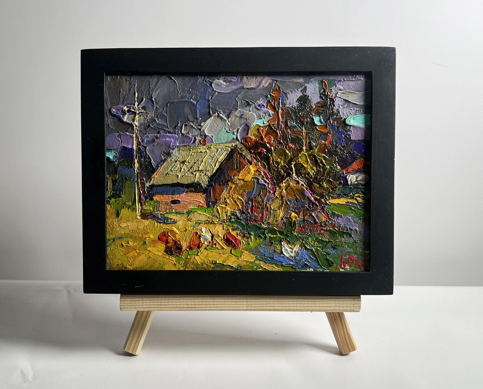 Vibrant oil painting of village after rain by Oksana Ivanyuk in black frame