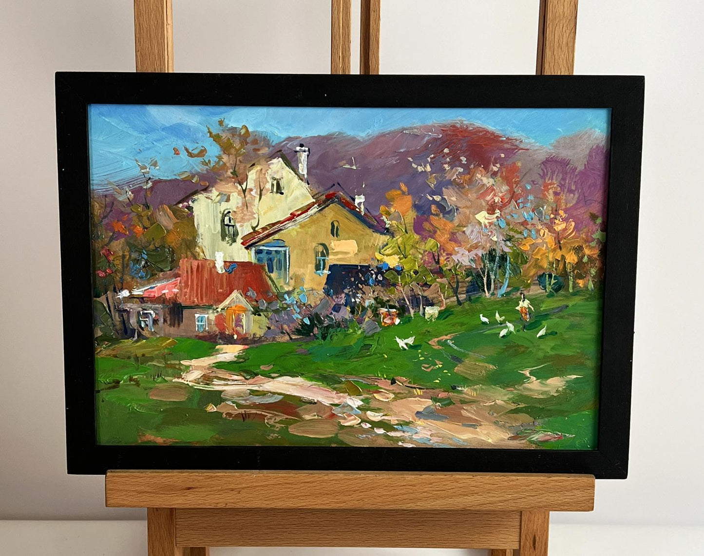 Vibrant impressionist oil painting of autumn countryside by Yuriy Suprunchuk, black frame
