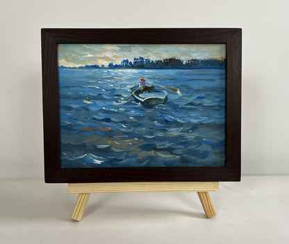 Oil painting In the Evening in a Boat by Yuriy Suprunchuk in dark frame