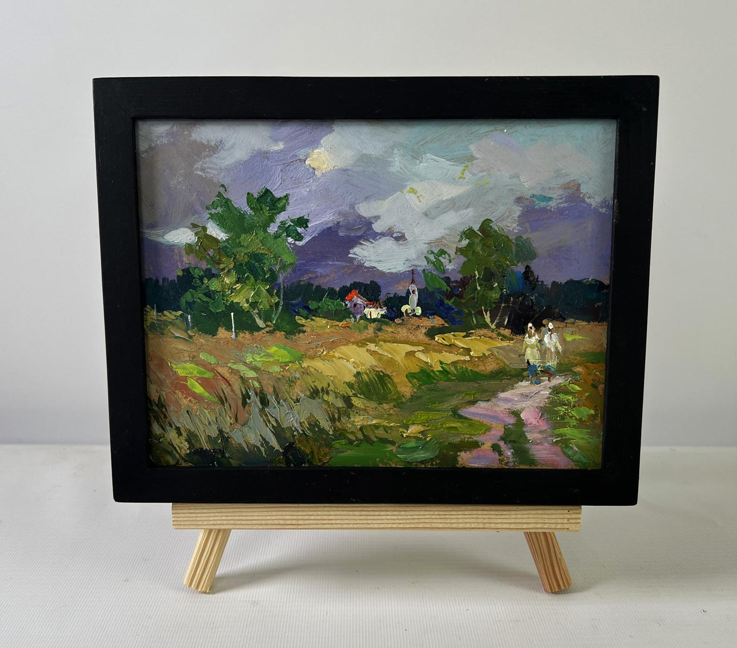 Black-framed oil painting Quiet Village in Endless Expanses by Yuriy Suprunchuk
