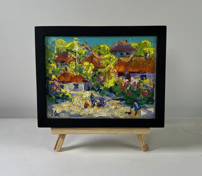 Oil painting Bloom and Light Between Buildings by Oleksiy Ivanyuk in black frame
