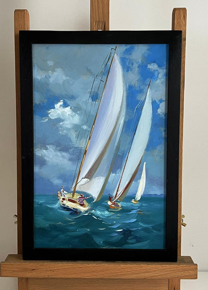 Oil painting of sailboats at sea by Yuriy Suprunchuk in black frame