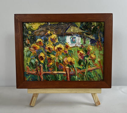 Vibrant impressionist oil painting of sunflowers in garden by Oksana Ivanyuk, framed