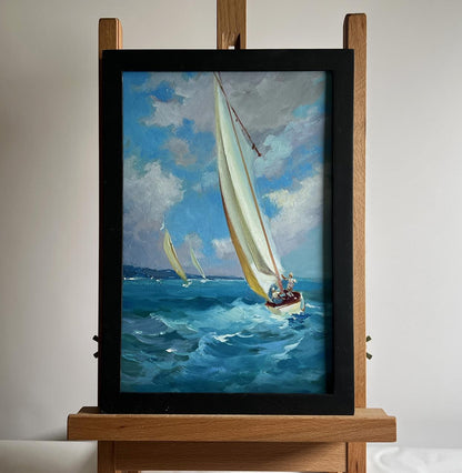 Oil painting of sailboat on blue waves by Yuriy Suprunchuk in black frame
