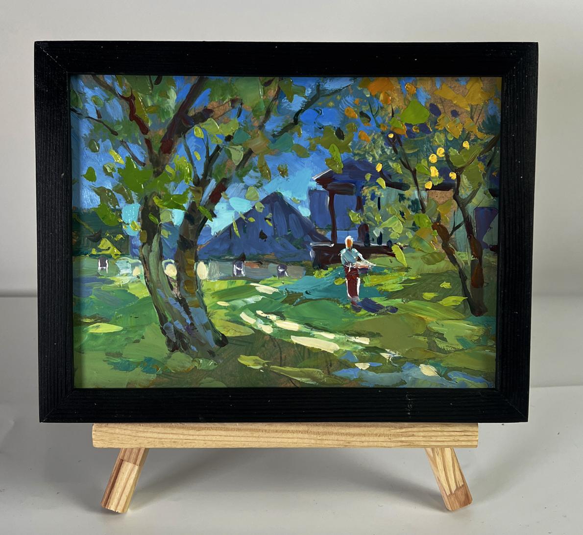 Black-framed oil painting Near the village houses by Yuriy Suprunchuk