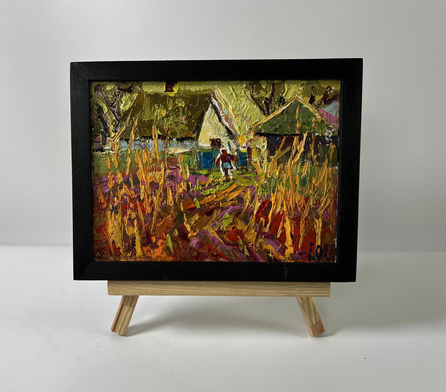 Oil painting Warm autumn in the village by Oleksiy Ivanyuk in black frame