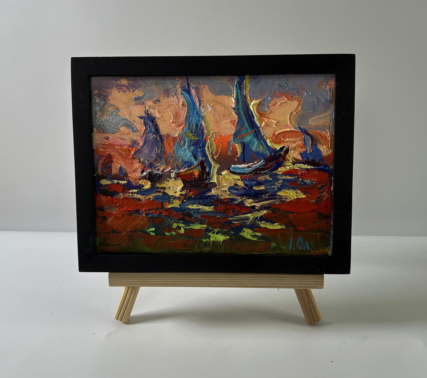 Oil painting of sailboats and orange sunset by Oleksiy Ivanyuk