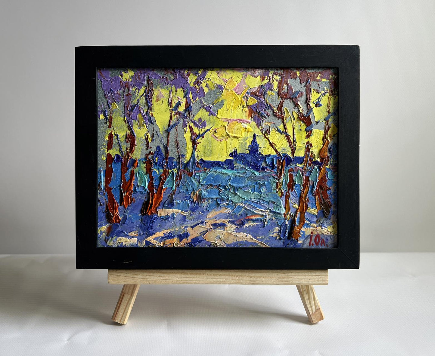 Oil painting Winter evening with yellow sunset by Oleksiy Ivanyuk in black frame