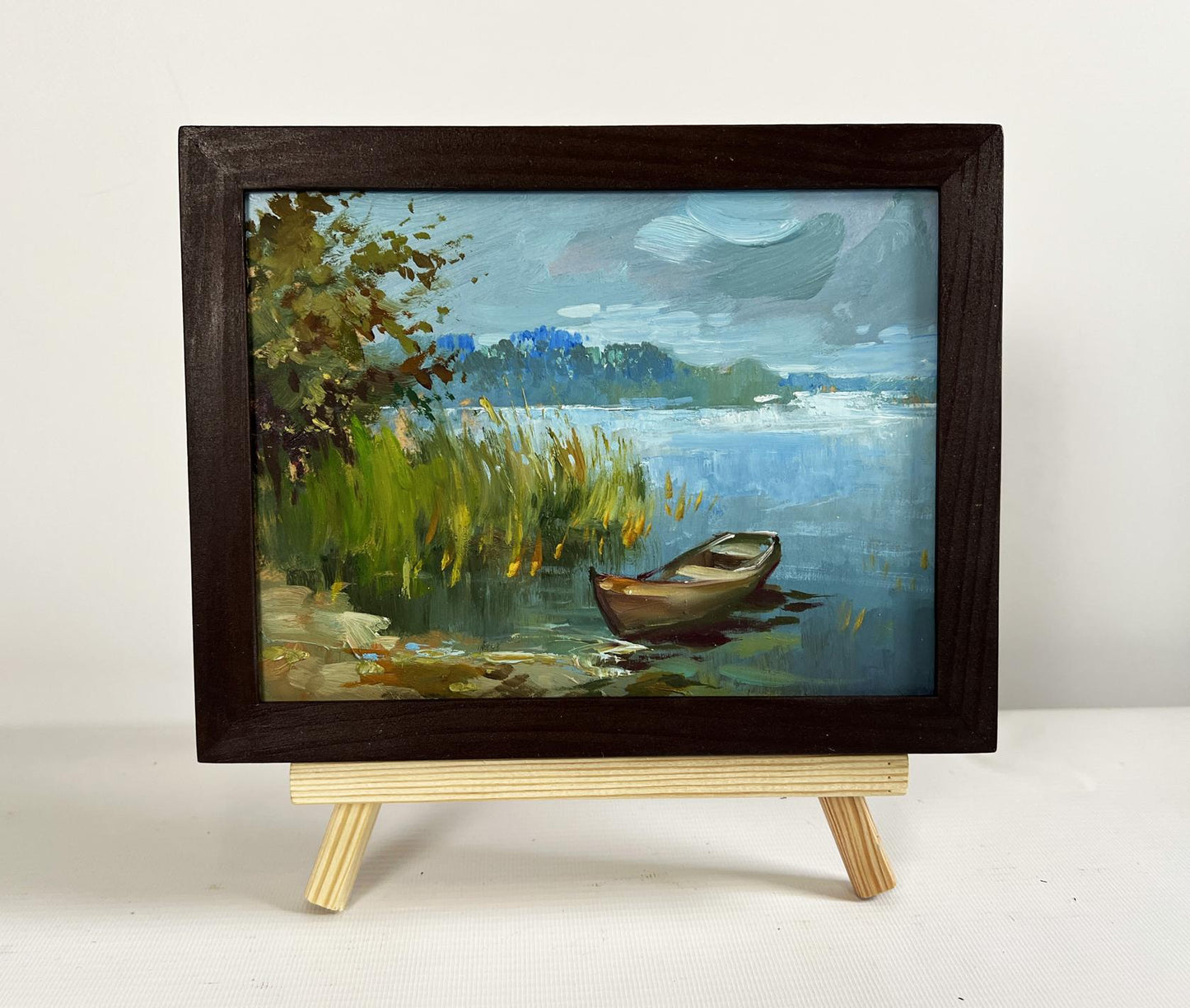 Oil painting A boat among the reeds by Yuriy Suprunchuk lakeside scene
