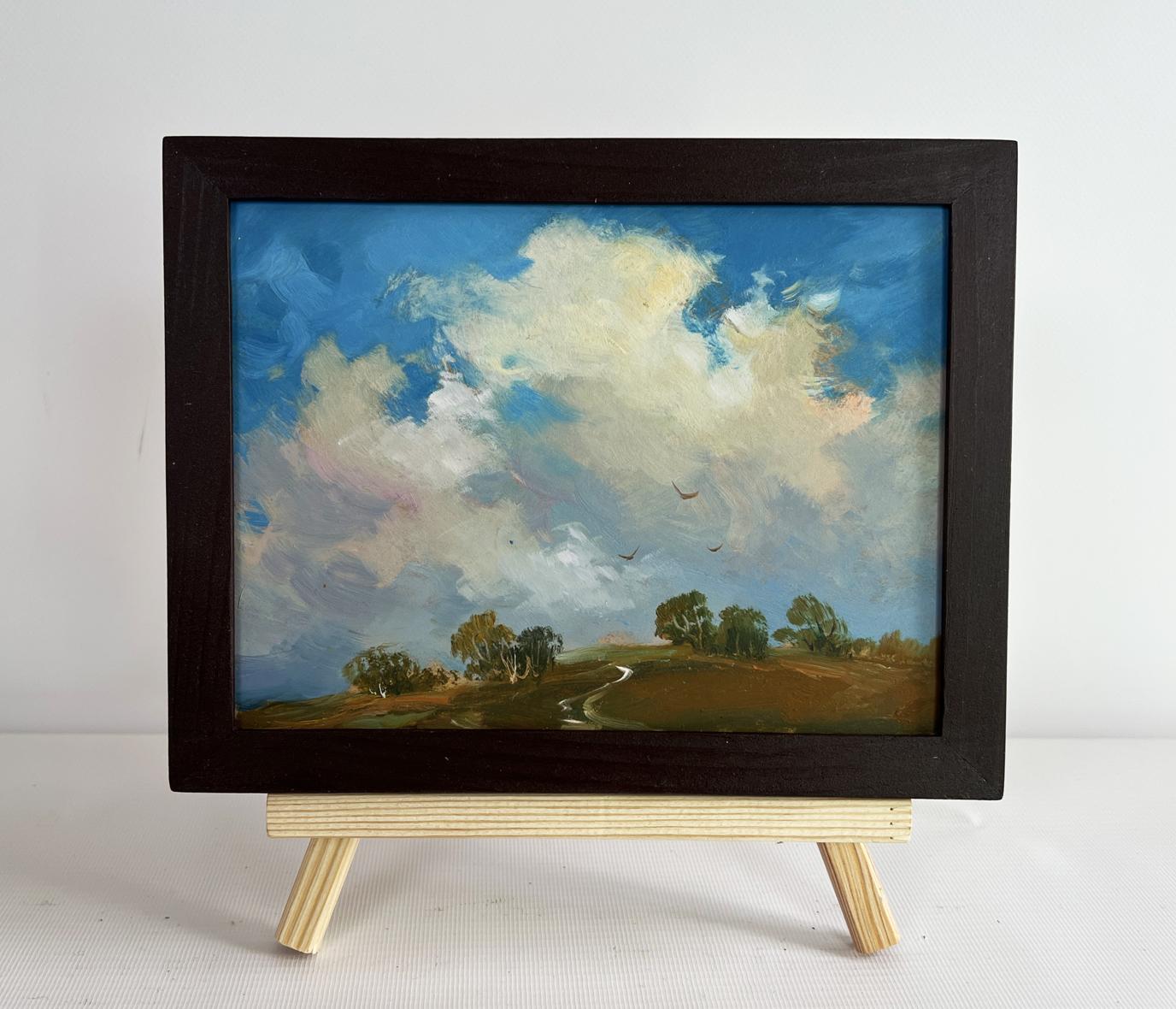 Oil painting Birds flying home by Yuriy Suprunchuk in dark frame on easel