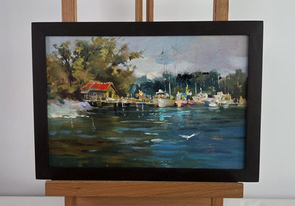 Framed oil painting of serene small yacht club by Yuriy Suprunchuk