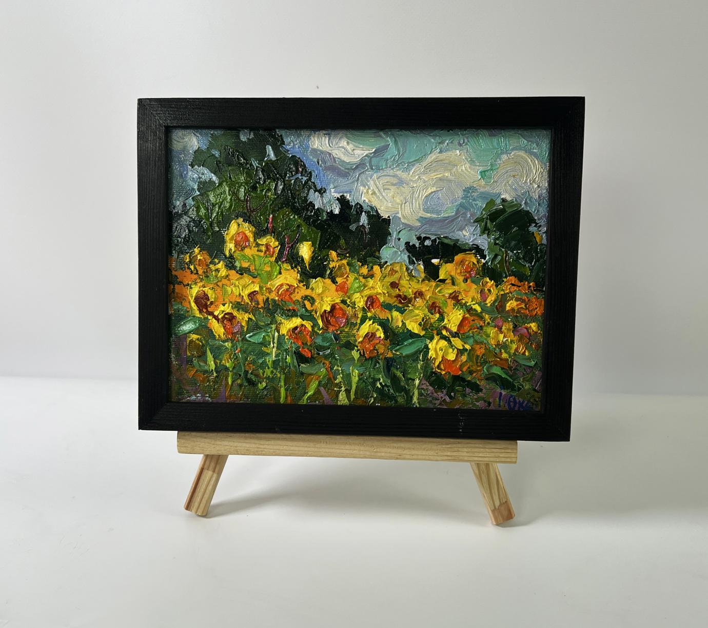 Vibrant oil painting of sunflower field by Oksana Ivanyuk in black frame