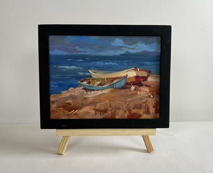 Oil painting Calm evening sea by Yuriy Suprunchuk: boats on rocky shore