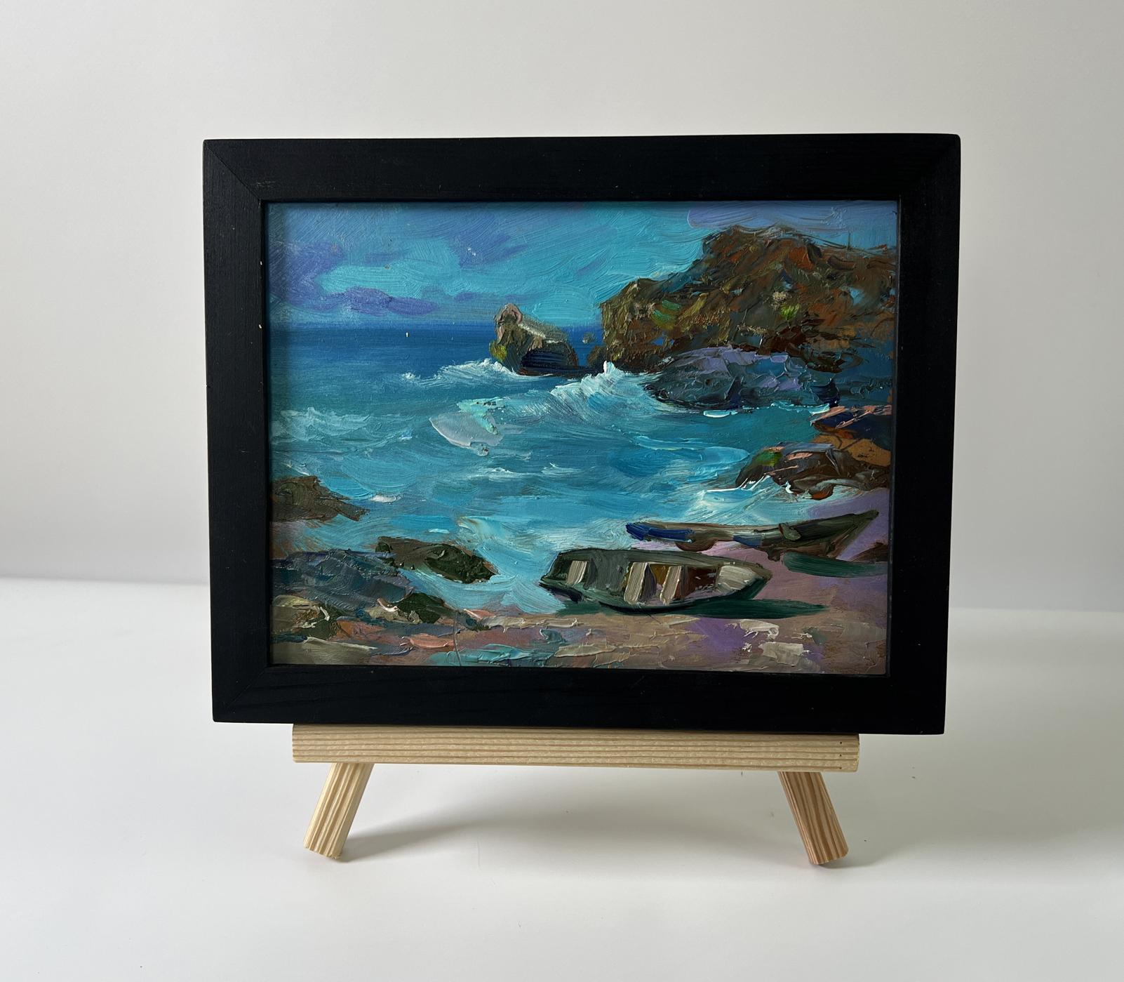 Framed oil painting of boats on seashore by Yuriy Suprunchuk