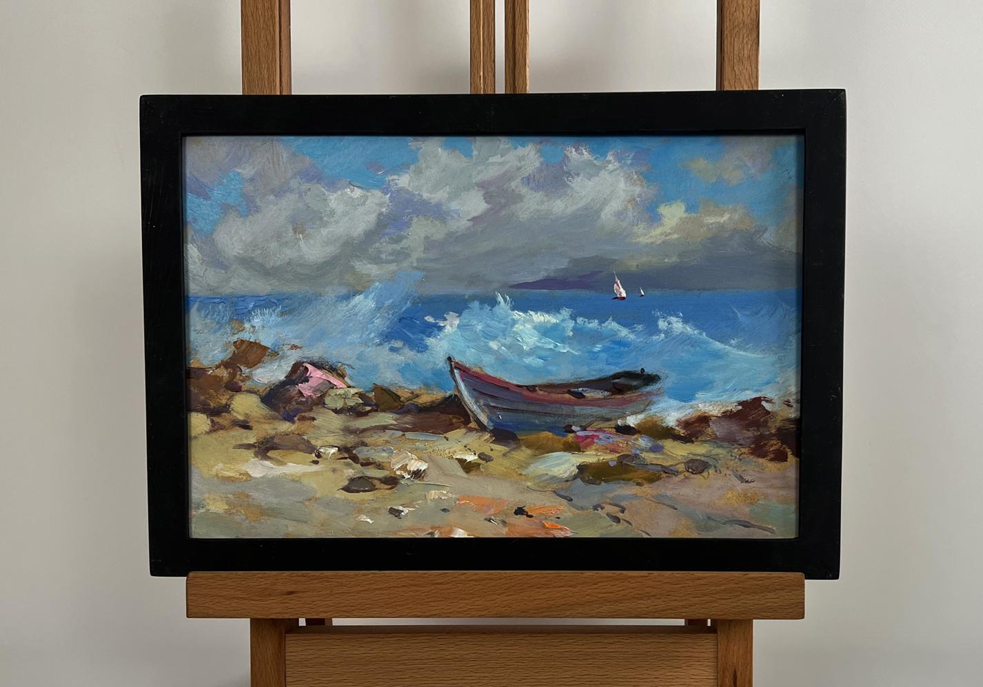Framed oil painting of weathered red boat on rocky shores by Yuriy Suprunchuk