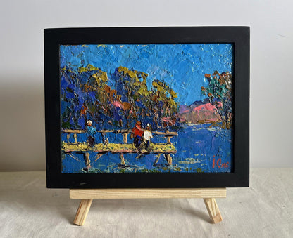 Oil painting Admiring the River by Oksana Ivanyuk in black frame