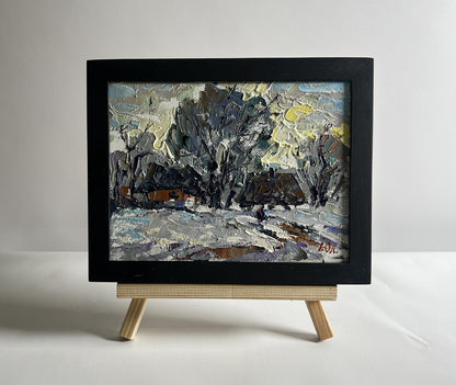 Oil painting Winter morning in the village by Oleksiy Ivanyuk in black frame