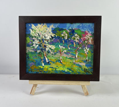 Oil painting Blooming spring garden by Oksana Ivanyuk on wooden easel