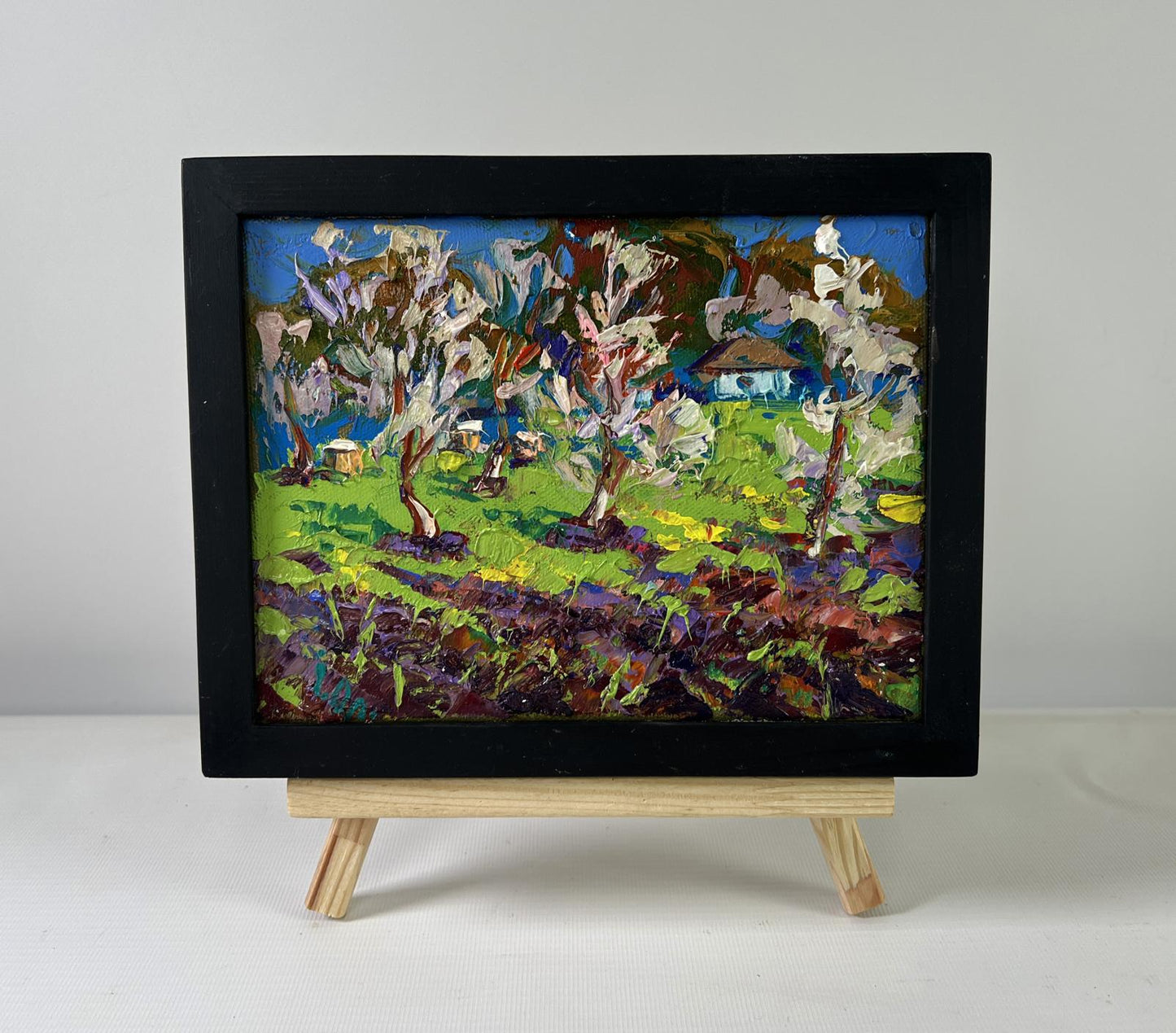 Oil painting Spring awakens in light by Oleksiy Ivanyuk, orchard scene