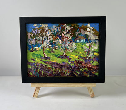 Oil painting Spring awakens in light by Oleksiy Ivanyuk, orchard scene