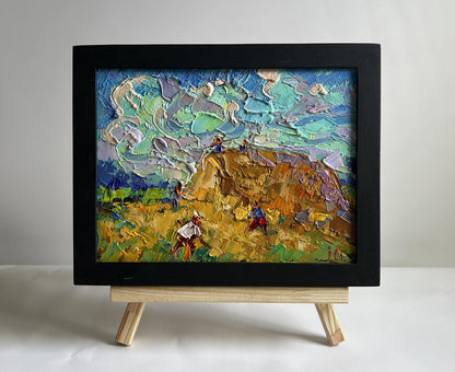 Oil painting Working in the field with hay by Oleksiy Ivanyuk in black frame