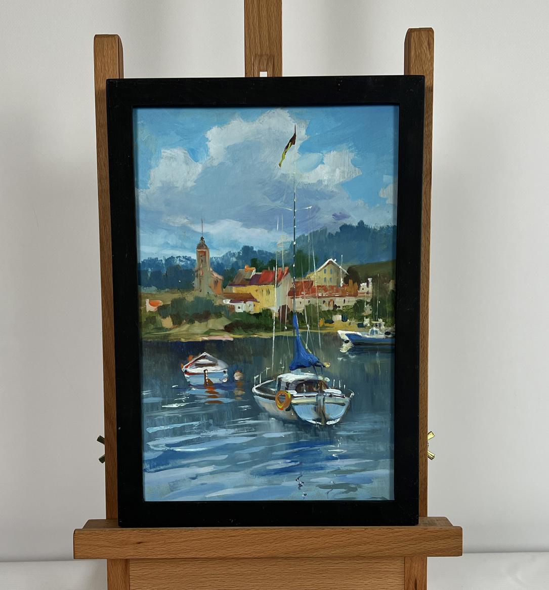 Oil painting Boats off the city coast by Yuriy Suprunchuk in black frame on easel