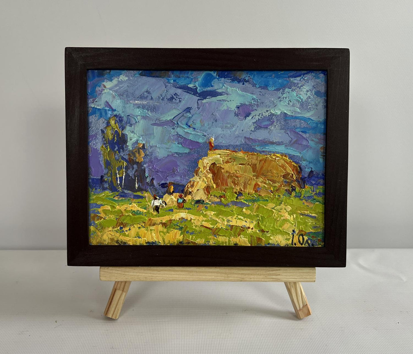 Oil painting Harvesting hay in field by Oleksiy Ivanyuk in dark wood frame