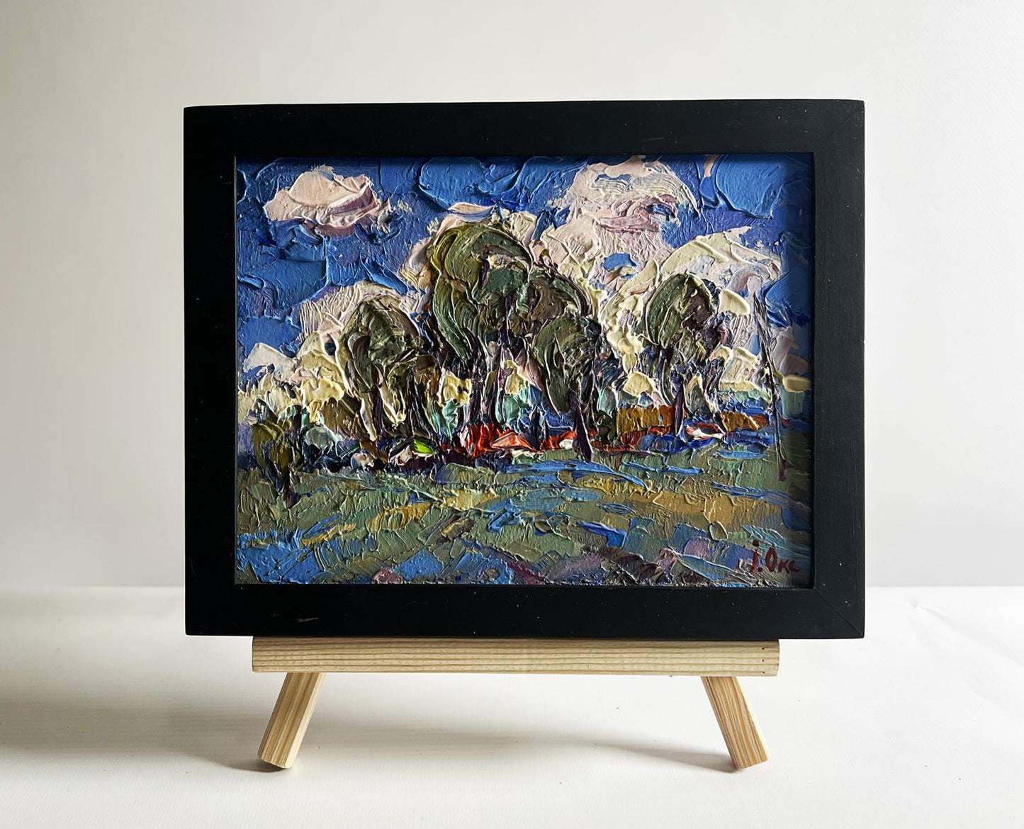 Oil painting by Oksana Ivanyuk: Clouds over village in impasto style