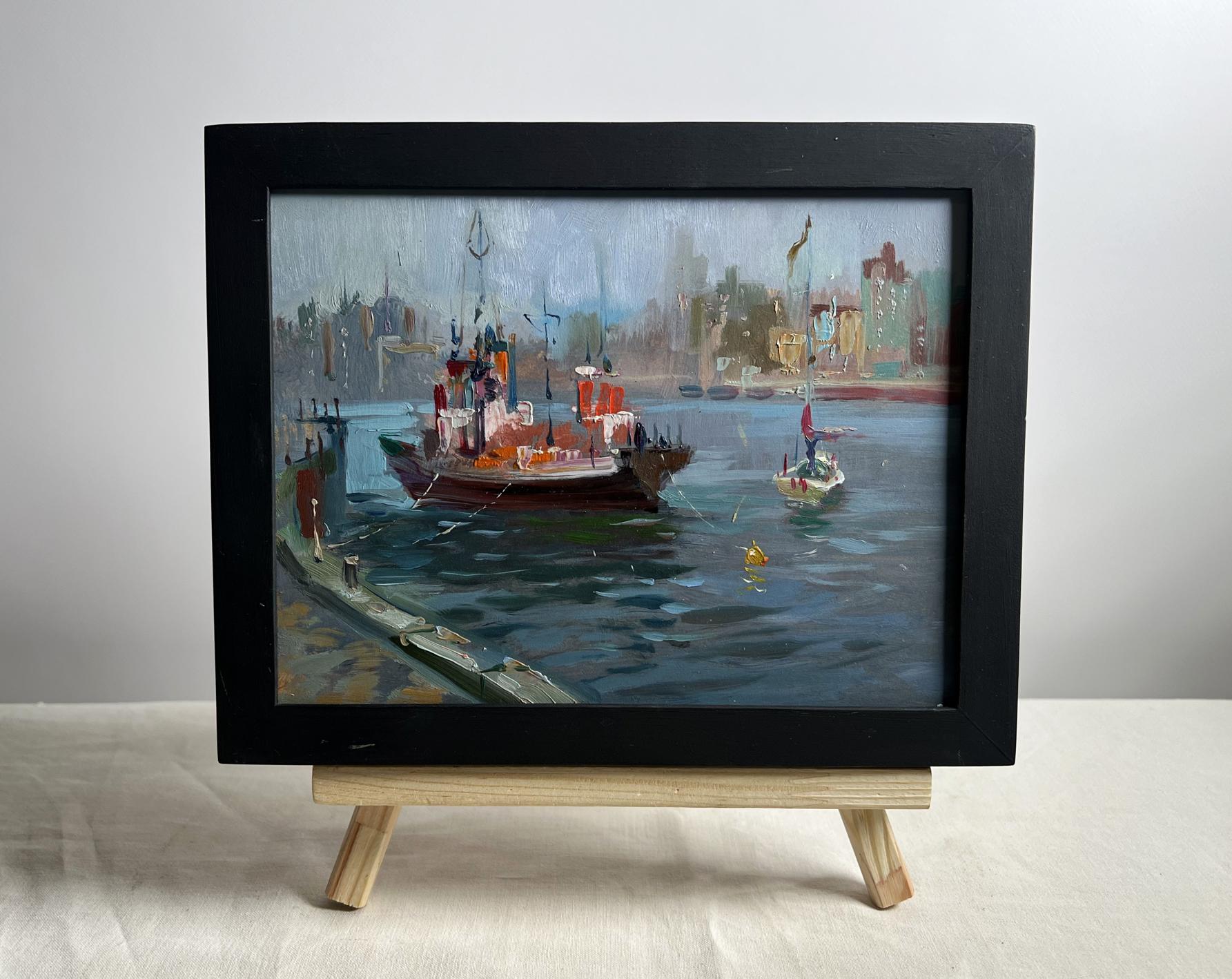 Black-framed oil painting of ship at pier by Yuriy Suprunchuk
