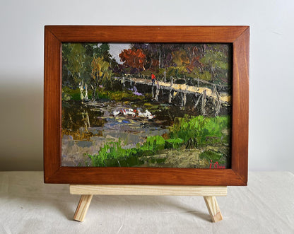 Oil painting by Oksana Ivanyuk: ducks on lake near bridge in autumn landscape