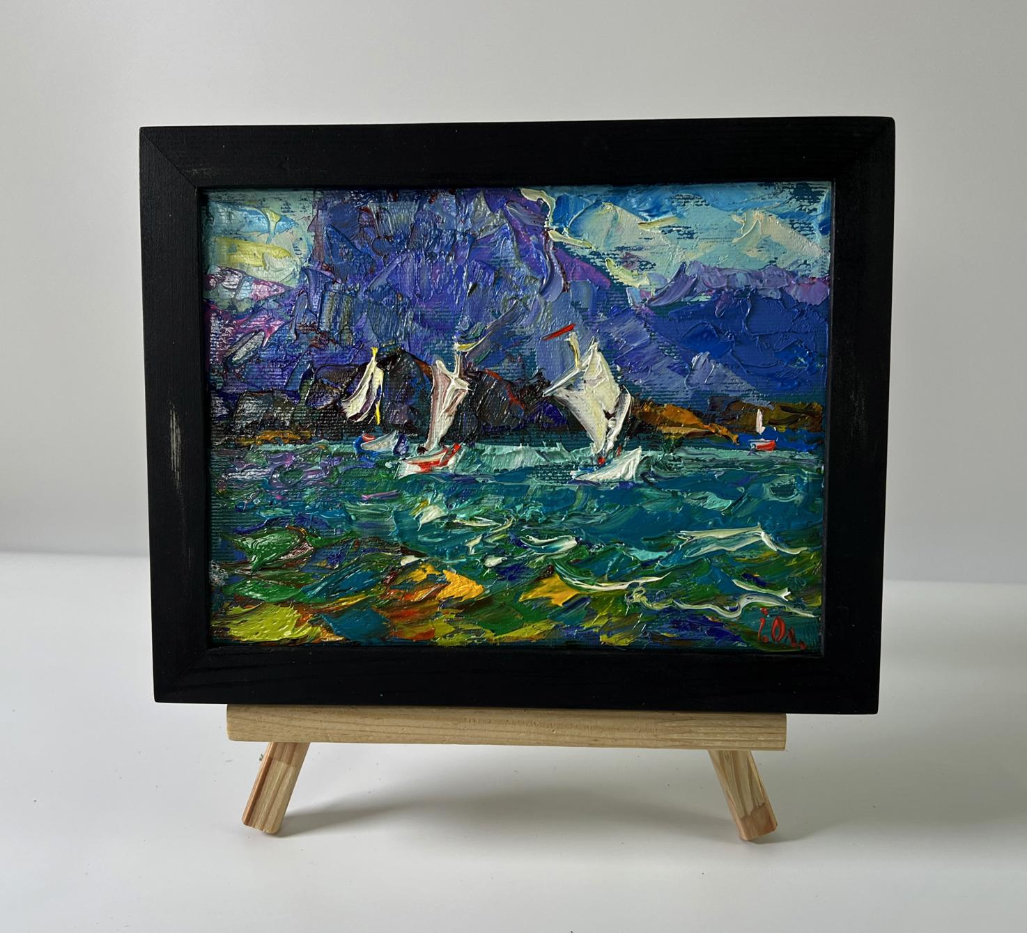 Oil painting Boats on the shore by Oleksiy Ivanyuk in black frame on easel