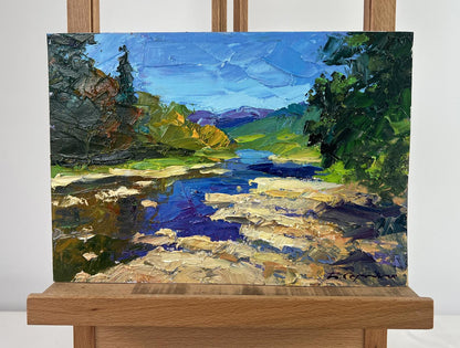 Vibrant oil painting of river against mountain slopes by Boris Serdyuk