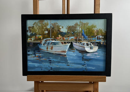 Framed impressionistic oil painting of white boats in harbor by Yuriy Suprunchuk