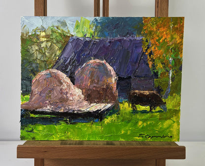 Oil painting of lonely cow by Boris Serdyuk with hay bales and barn