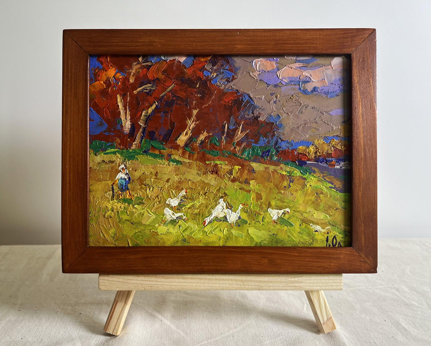 Oil painting Warm evening days by Oleksiy Ivanyuk: autumn trees, geese, blue figure